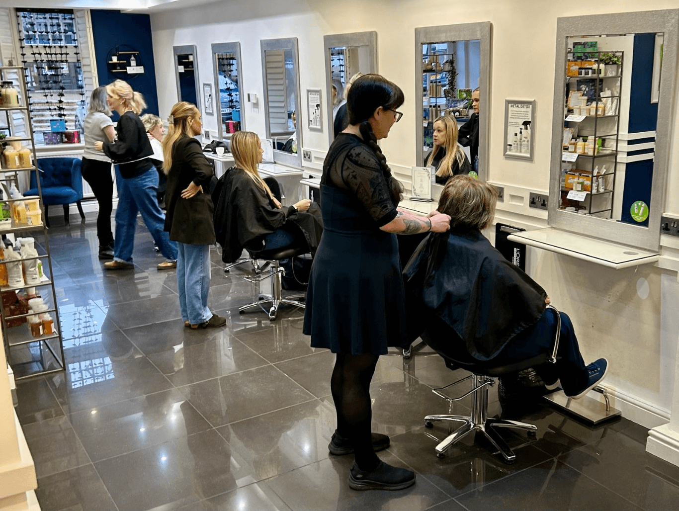 Professional stylists working with clients inside Michael Todd Hairdressing salon in East Grinstead – meet the team image