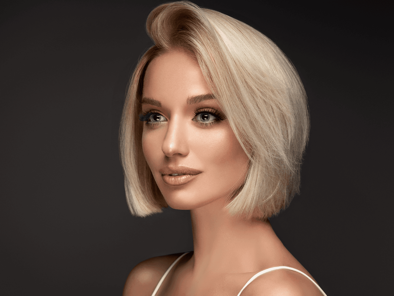 Woman with soft, blonde face-framing highlights at Michael Todd Hairdressing, East Grinstead — precision partial highlighting to enhance features, loved across West Sussex