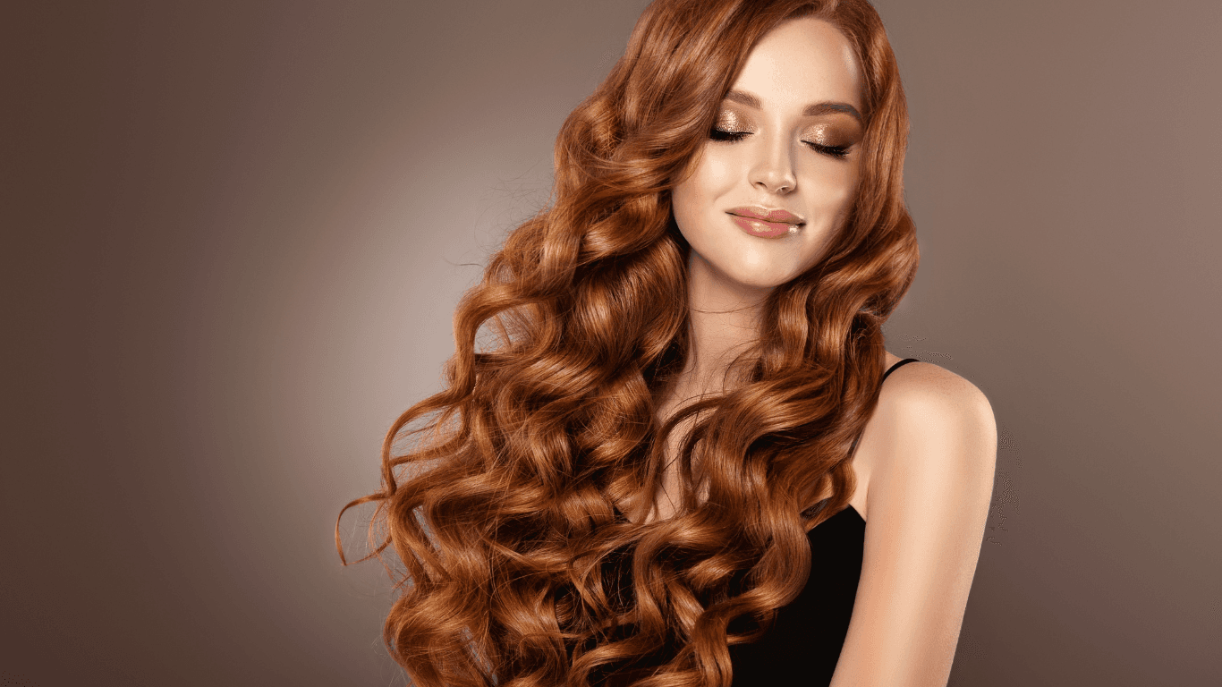 Woman with rich, vibrant red full head colour at Michael Todd Hairdressing, East Grinstead — expert all-over hair colour services across West Sussex