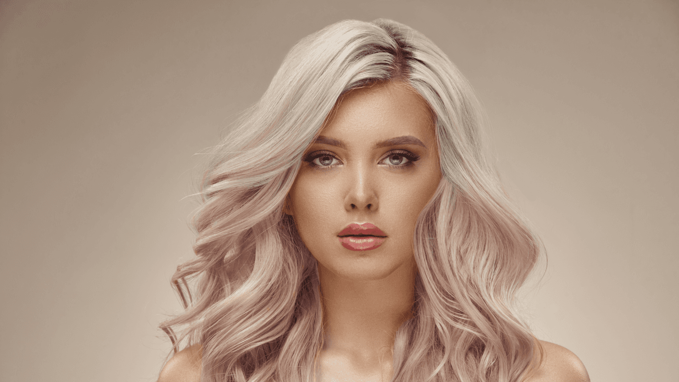Woman with luminous platinum-toned hair after a gloss and toner at Michael Todd Hairdressing, East Grinstead — expert colour refinement and shine treatment in West Sussex