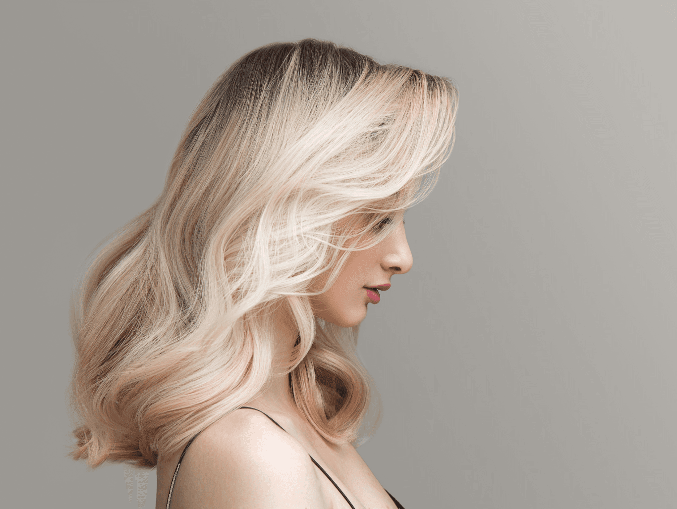 Woman with soft, dimensional half head foil highlights at Michael Todd Hairdressing, East Grinstead — expert partial highlight services in West Sussex