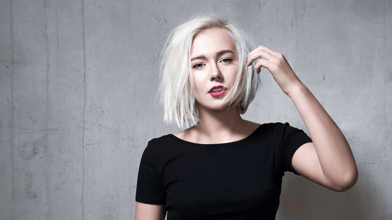 Woman with a bold blonde bob after a restyle and blowdry at Michael Todd Hairdressing, East Grinstead — expert cutting and styling services in West Sussex