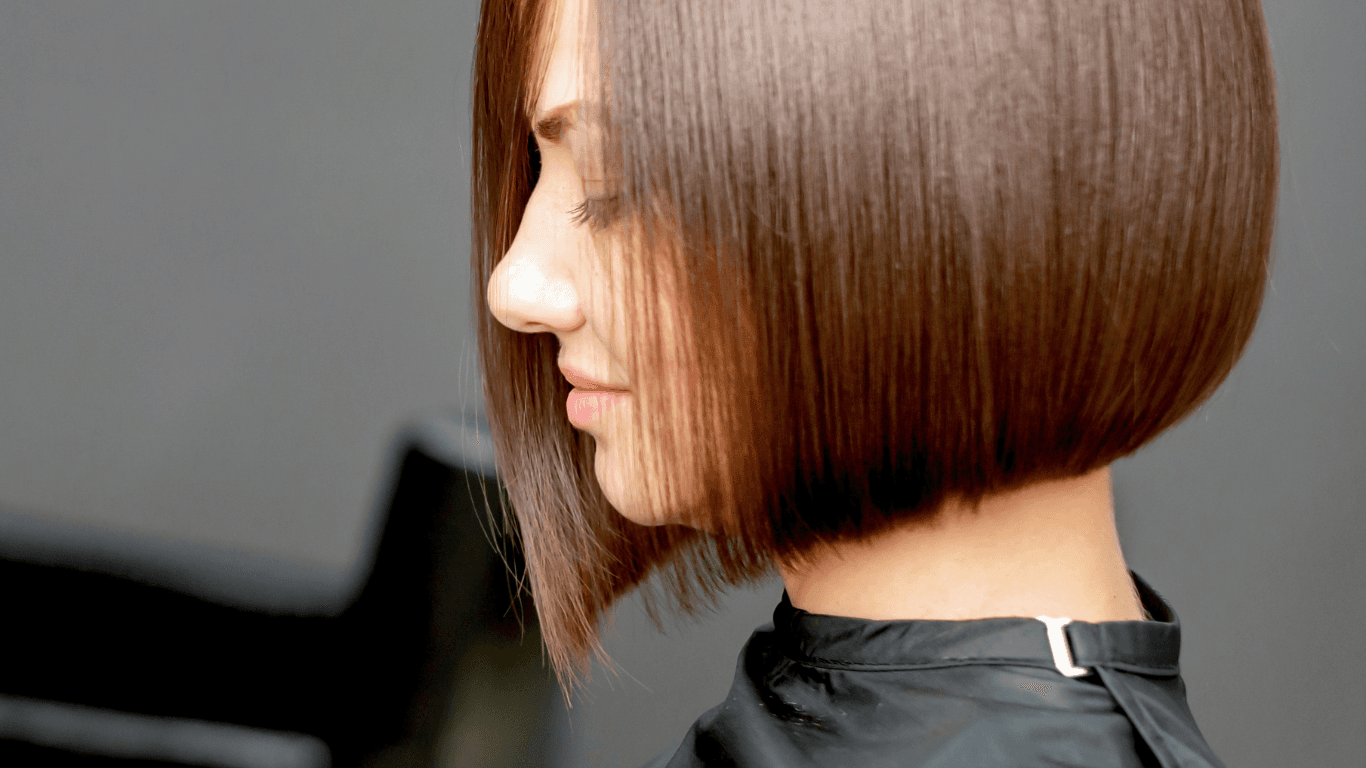 Woman with sleek, glossy hair after a professional blowdry at Michael Todd Hairdressing, East Grinstead expert shampoo and blowdry services across West Sussex