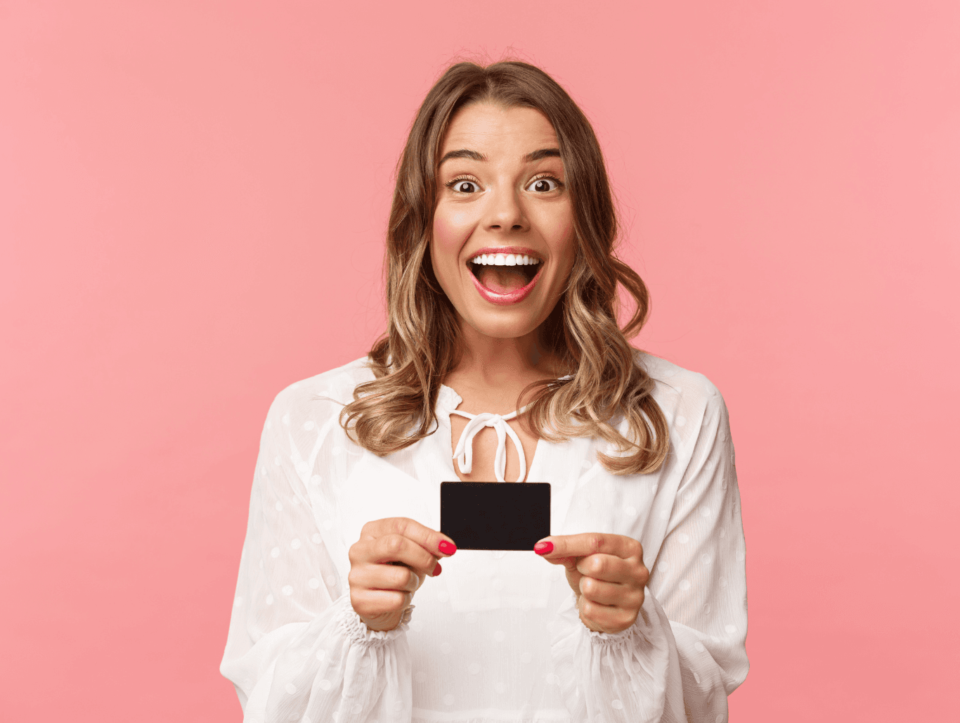 Smiling woman holding a black gift card against a pink background – gift voucher image for Michael Todd Hairdressing