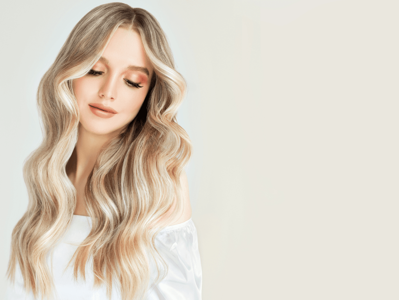 Woman with bright, blended full head foil highlights at Michael Todd Hairdressing, East Grinstead — expert blonding and highlight services in West Sussex